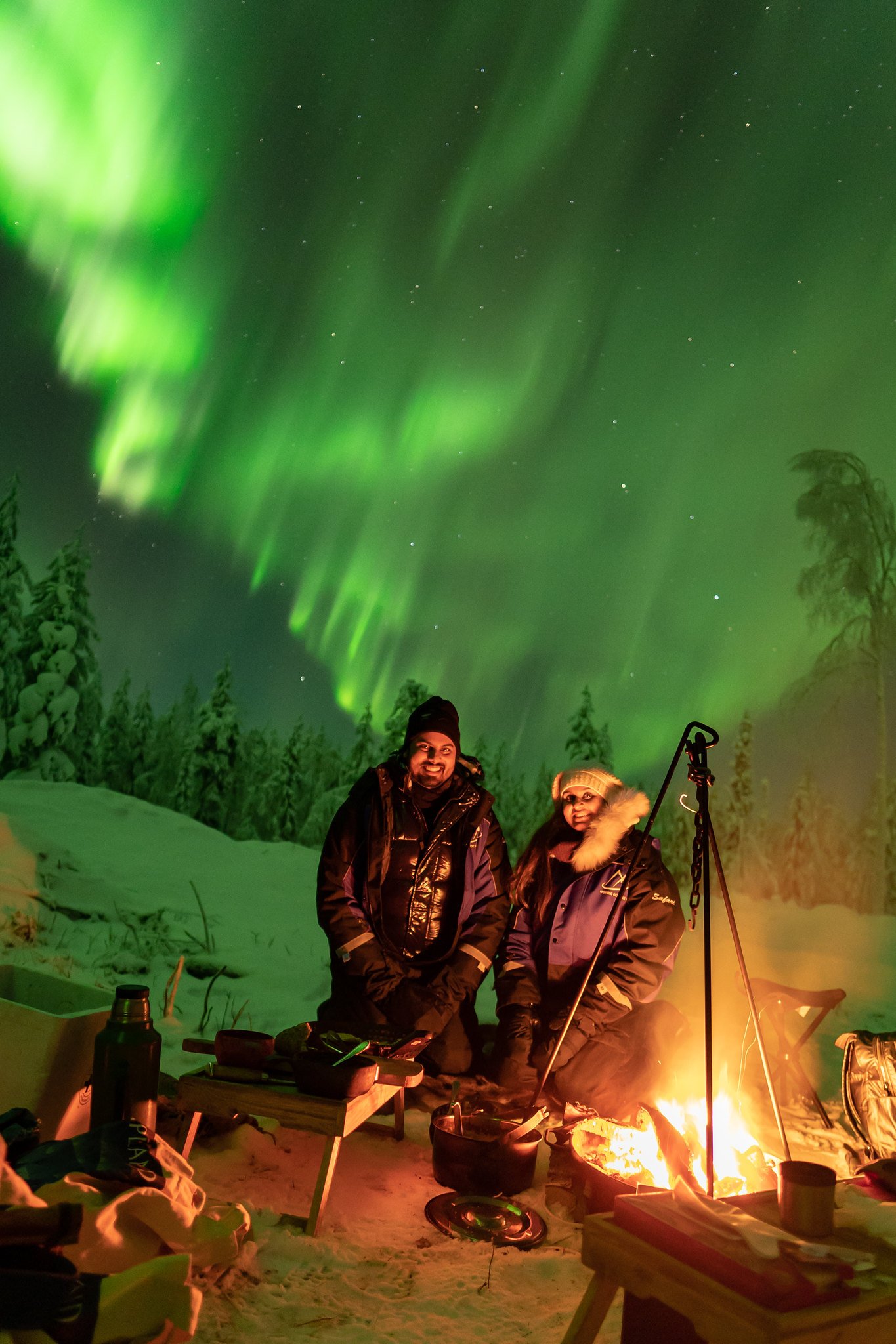 Northern lights with people having dinner