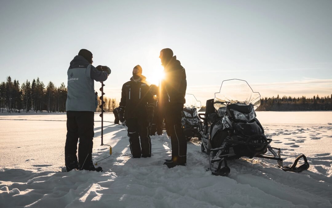 Ice fishing with electric snowmobiles from Rovaniemi