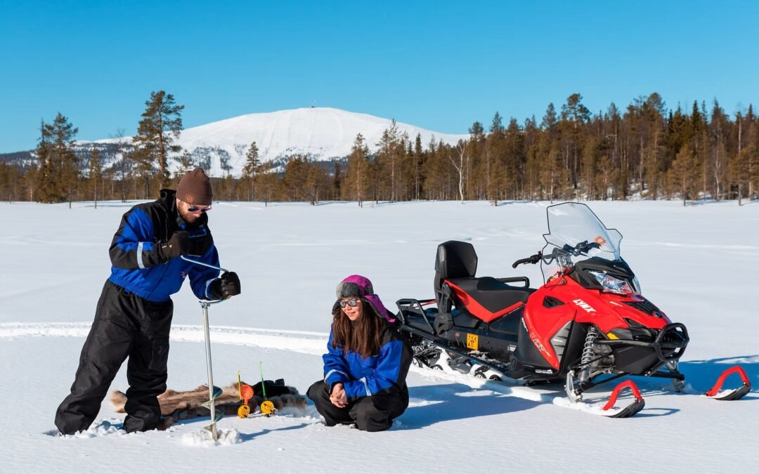 Ice fishing experience by snowmobiles from Ylläs