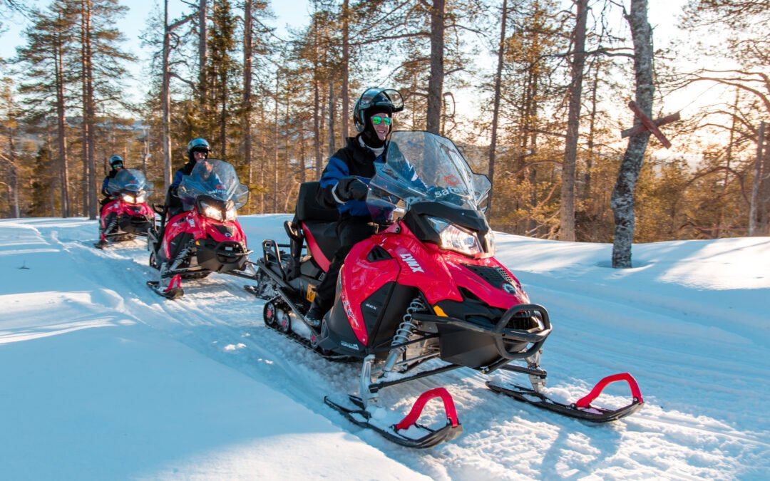 Snowmobile safari with ice fishing and outdoor lunch in Levi