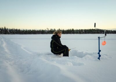 ice fishing lake rovaniemi lapland
